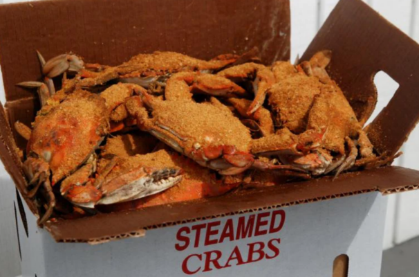 a box of Steamed blue crabs with brown powder